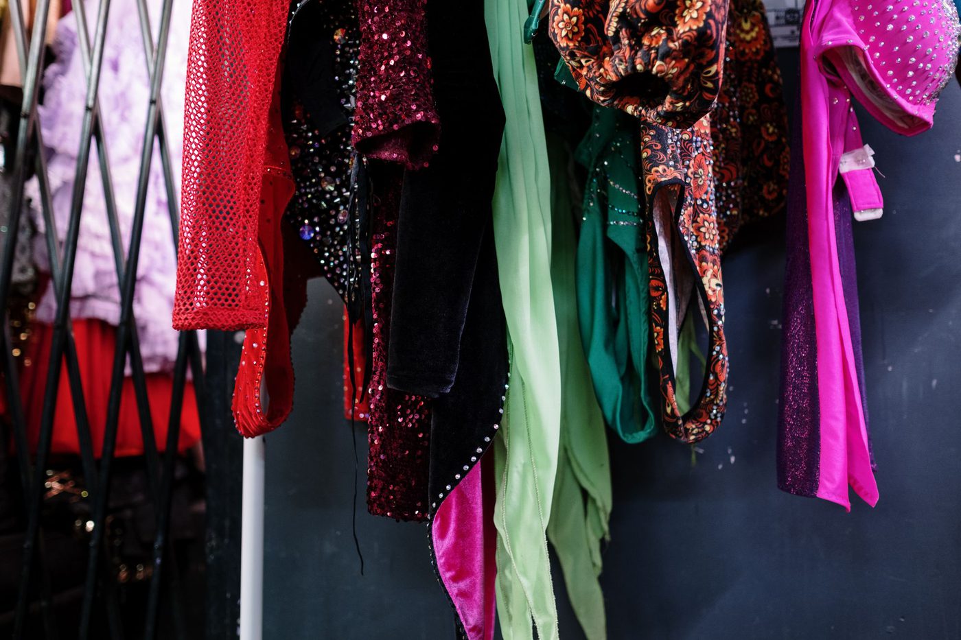 Colorful costumes hanging on a rack, ready to browse